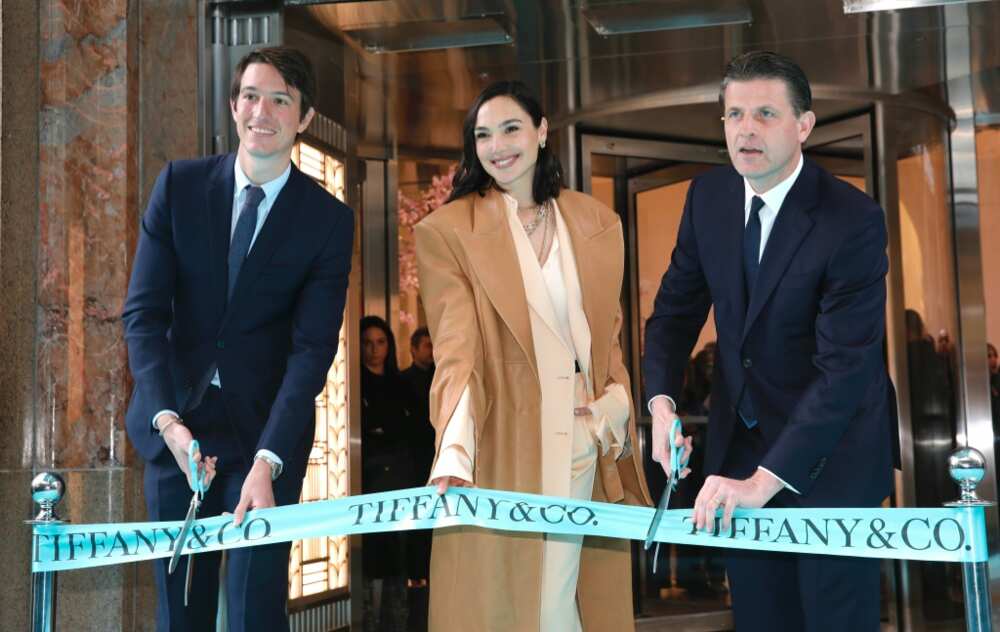Tiffany Executive Vice President of Products and Communication Alexandre Arnault (L), actress Gal Gadot (C), and Tiffany CEO Anthony Ledru (R) cut the ribbon for  Tiffany's flagship store in New York