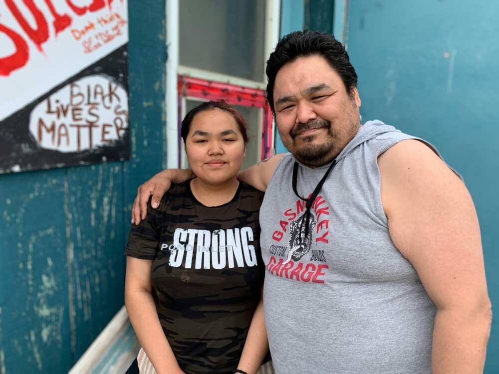 Karol Mablick and her father Israel, a survivor of Canada's residential school system, pose for a photo in Iqaluit, Nunavut, Canada, July 28, 2022, ahead of the pope's visit to apologize for the Church's role in the schools abuse