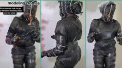 "No body contact": Okrika seller wraps herself with cellophane before modelling her clothes in video