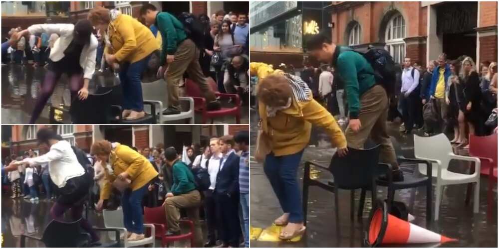 Londoners mounted chairs to cross floodwater.