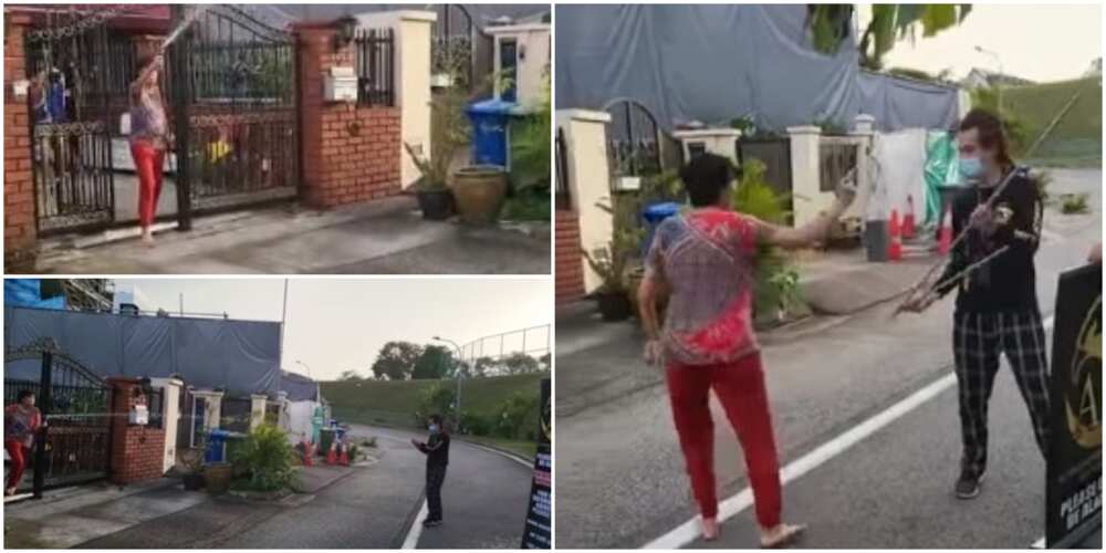 Reactions as woman drenches debt collectors who showed up at her house with water