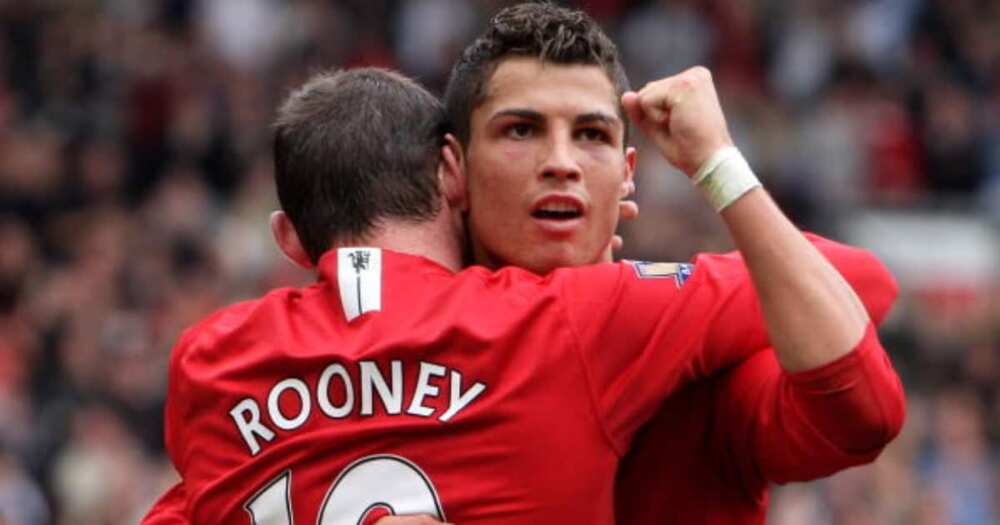 Cristiano Ronaldo celebrates scoring his second a goal with Wayne Rooney during the Barclays Premier League match between Manchester United and Wigan Athletic at Old Trafford on October 06, 2007 in Manchester, England. (Photo by Phil Cole/Getty Images)
