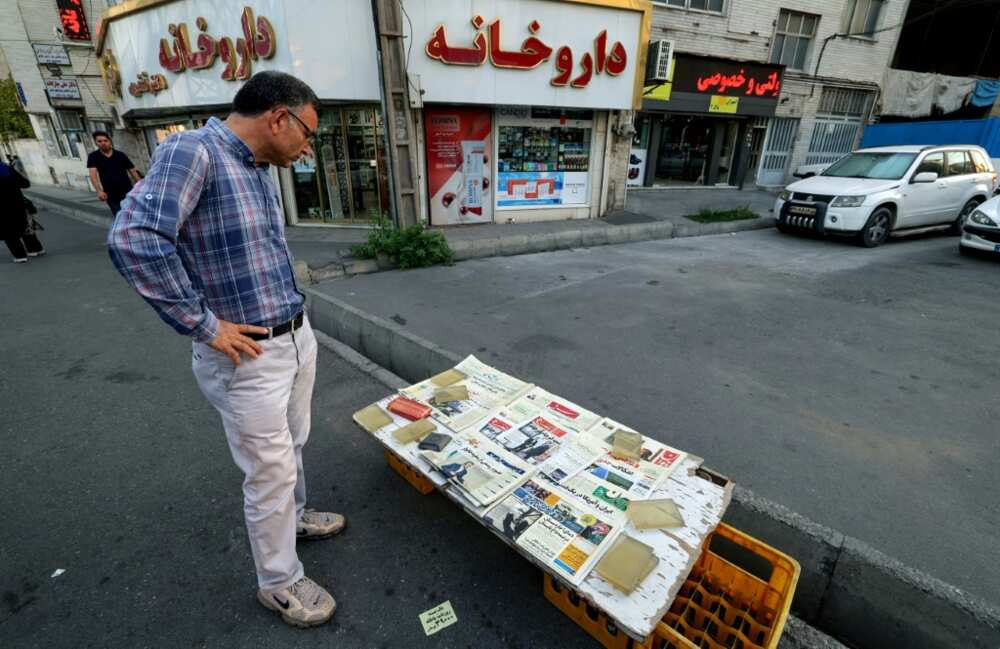Iran's Etemad newspaper bears the title "The Night of the End of the JCPOA" at a stall in the capital Tehran on August 16, 2022