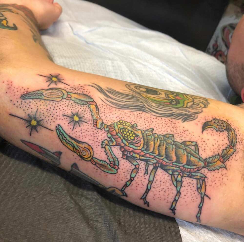 girly scorpion tattoos on arm