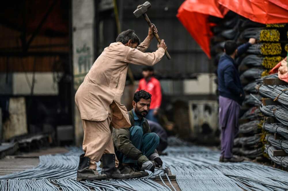 Labourers at a steel mill in Islamabad