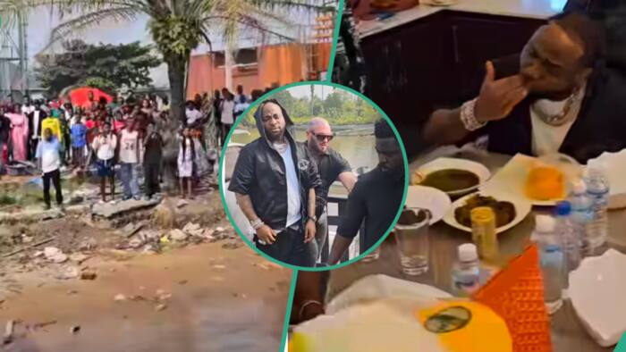 "Na starch OBO dey chop so": Reactions as Davido arrives Warri via water, dines with crew in video