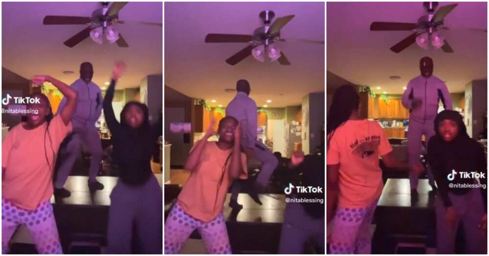 Rihanna, father and daughters dance, table