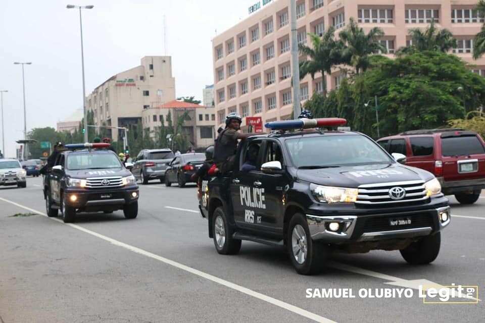 Security officials patrol vans around Federal High Court, Abuja