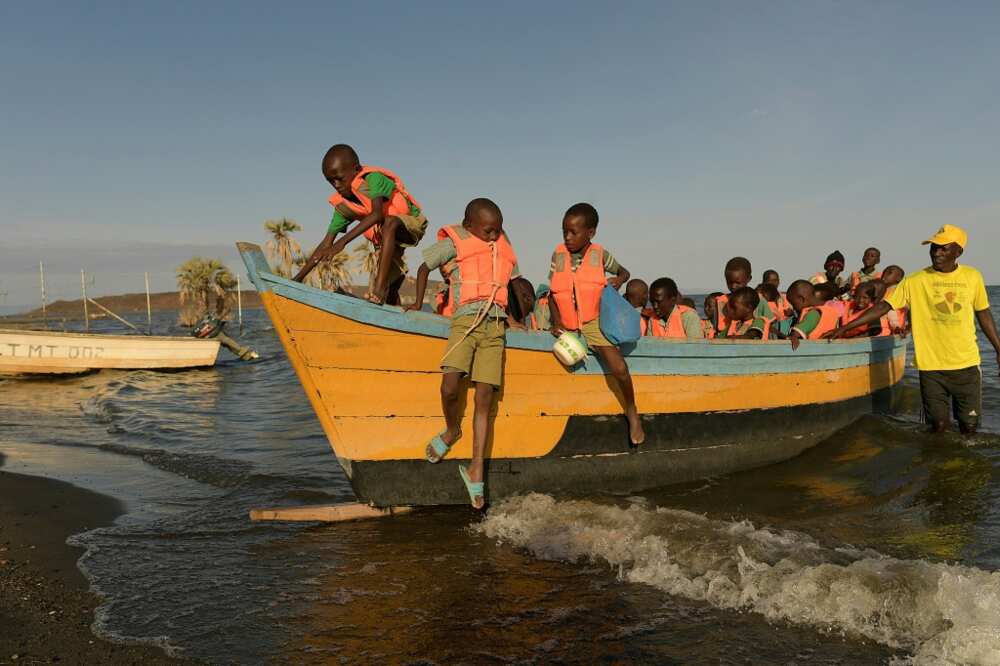 Children from the El Molo tribe have to take a fishing boat to school