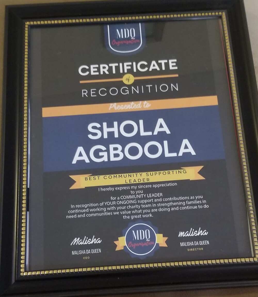 Among his recognitions is the award presented to him as Best Community Supporting Leader. Photo source: Shola Agboola