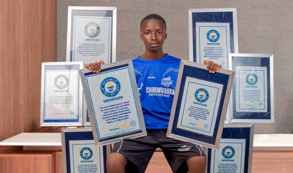 Photos of Victor Richard Kipo with his 8 Guinness World Records certificates.