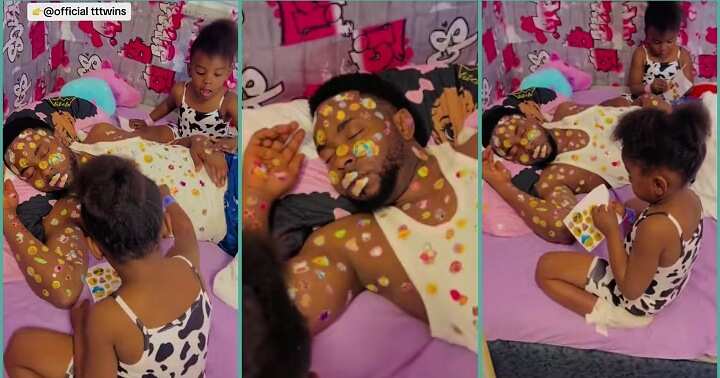 Watch hilarious video of little girls decorating their father's body with stickers