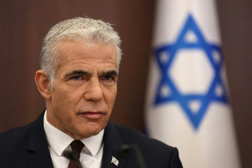 Israel's caretaker Prime Minister Yair Lapid chairs a cabinet meeting in Jerusalem on October 23, 2022
