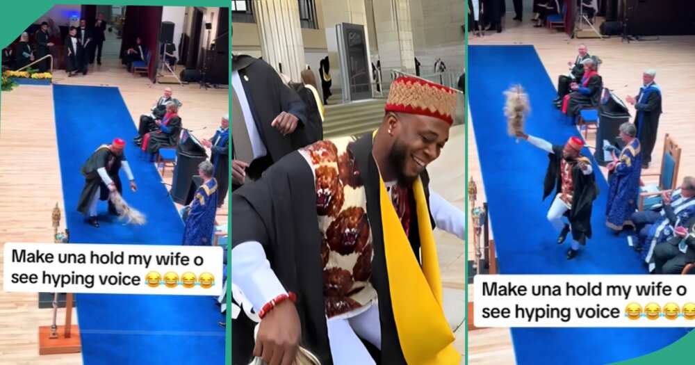 Man dances during graduation abroad.