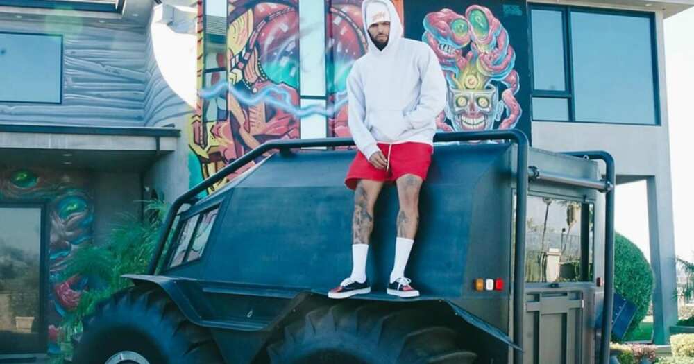Kanye West gifts singer Chris Brown tank like vehicle, internet erupts