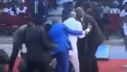 Man dressed in white suit attacks Bishop Oyedepo on pulpit while preaching, video emerges