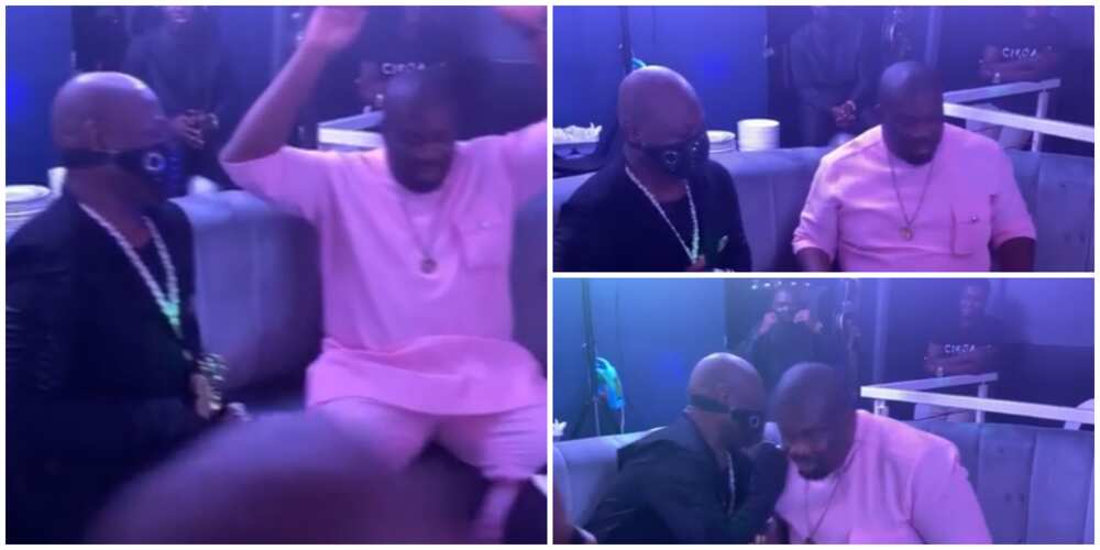 Don Jazzy goes on one kneel to greet 71-year-old Charly Boy.