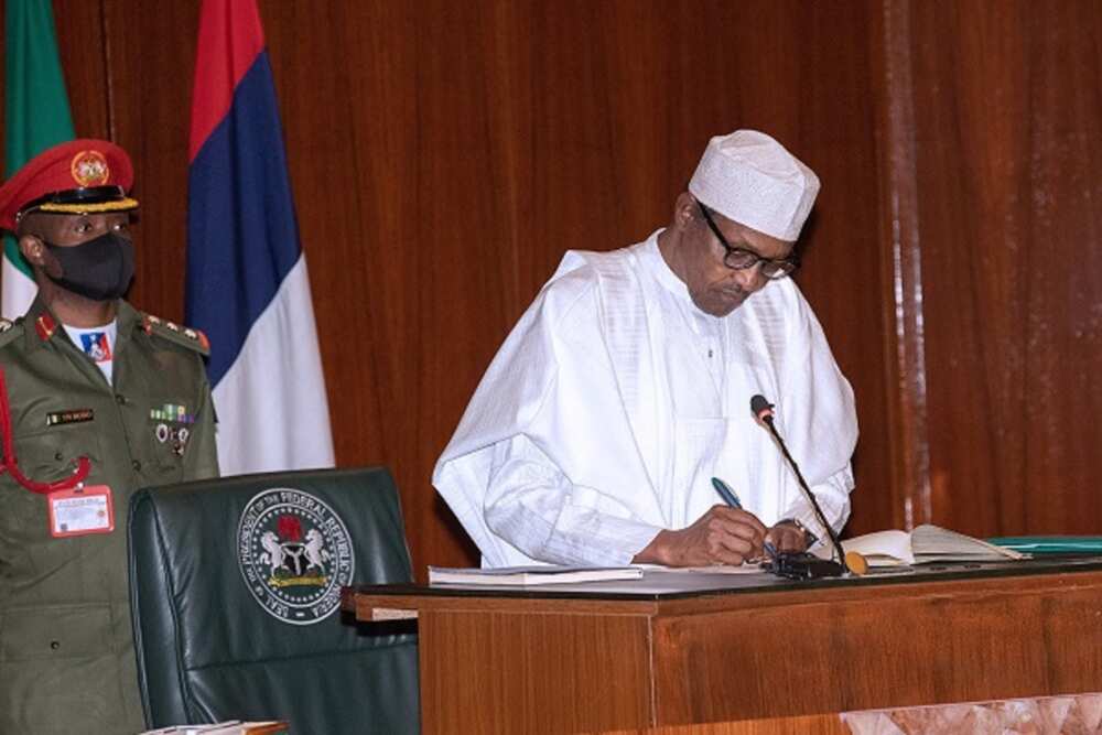 Buhari Signs Buhari Signs