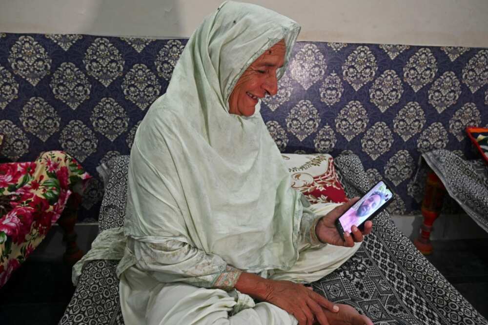 Mumtaz Bibi, who was separated from her family during partition 75 years ago, speaks with her nephew on a video call after finally meeting her siblings earlier this year