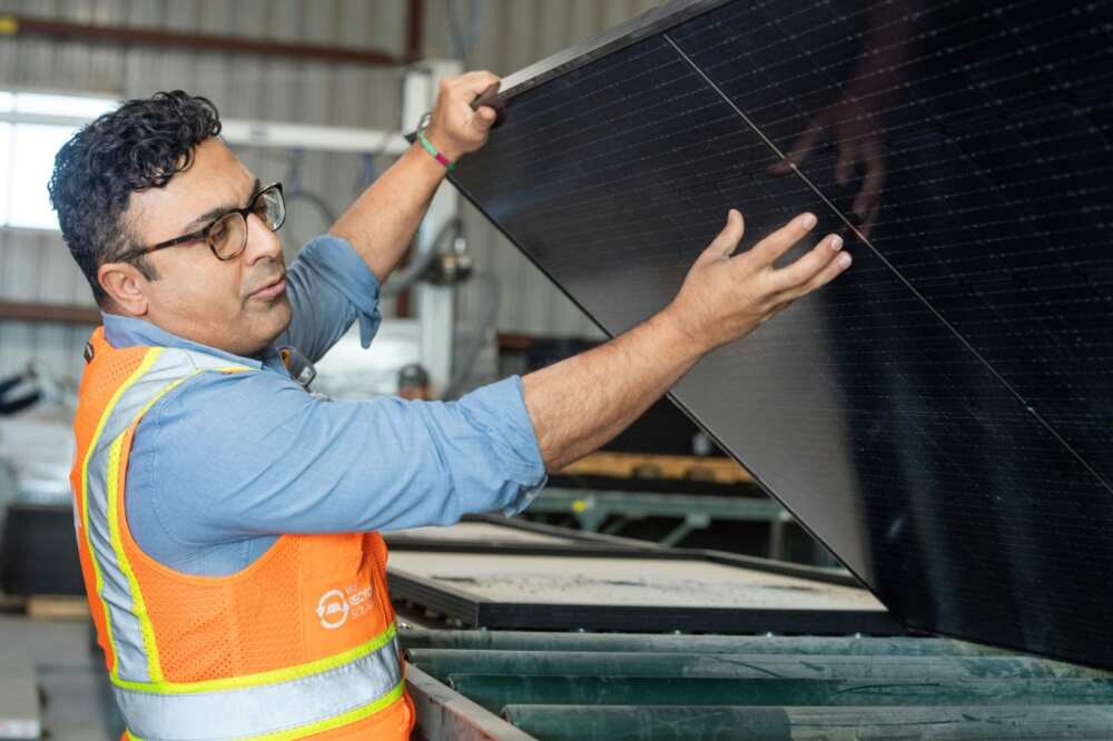 We Recycle Solar CEO Adam Saghei shows damaged solar panels to be recycled at a plant in Yuma, Arizona