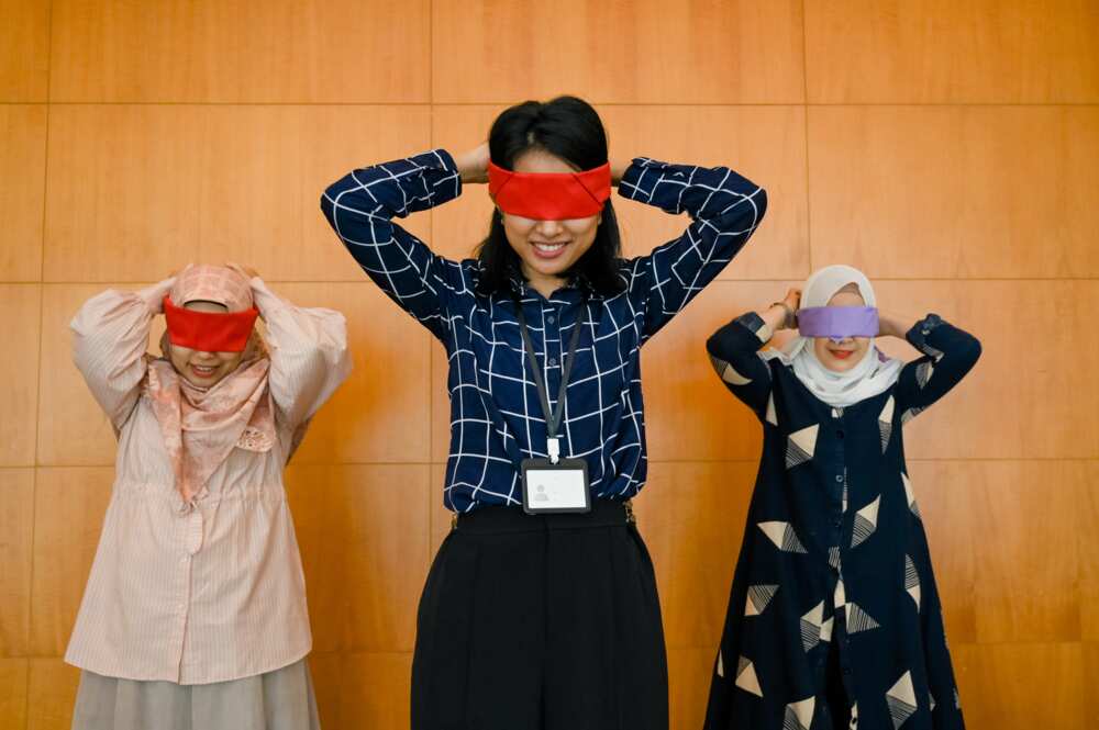 A family playing a blindfold game