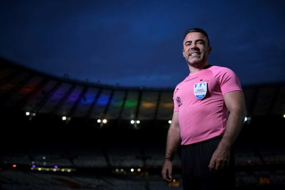 Brazilian premier league official Igor Benevenuto, pictured at the Mineirao stadium illuminated with the colors of the rainbow flag in Belo Horizonte, is one of a few trailblazing referees to publicly identify as gay