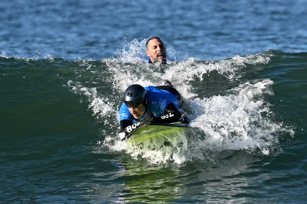 Pancho Arbulu, who lost the use of his arms and legs in a car accident, is launched by his teammate into a wave