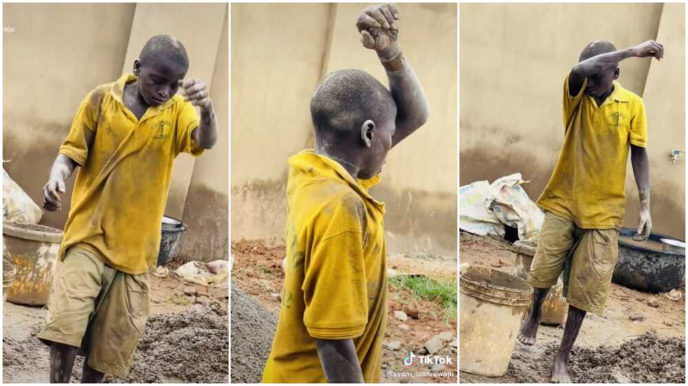 Poverty level in Africa/boy crying while working as a bricklayer.