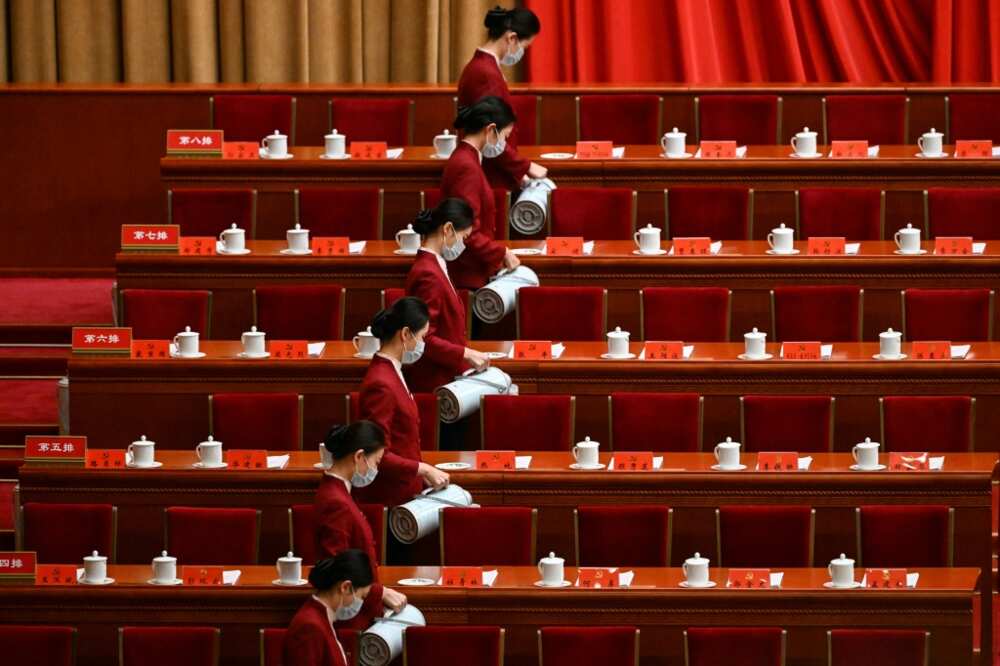 Attendants serve tea for the opening session of the Congress at Beijing's Great Hall of the People