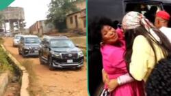 Nigerian lady shuts down her village after 11 years abroad, video shows her returning in convoy
