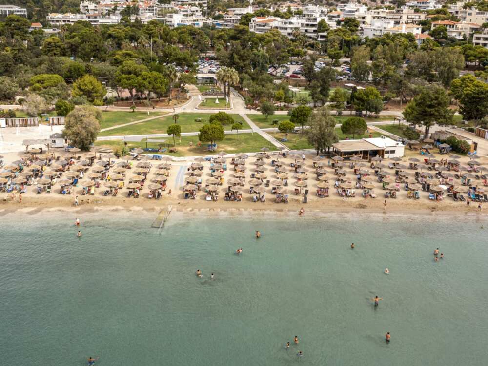 Greek law says 50 percent of every beach must be clear so people can get to the sea