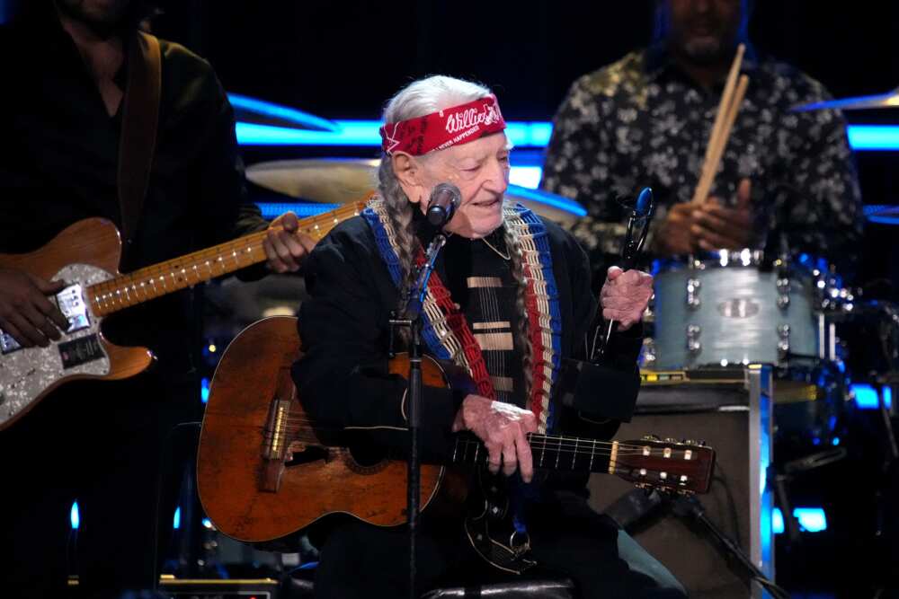Willie Nelson speaks onstage in New York