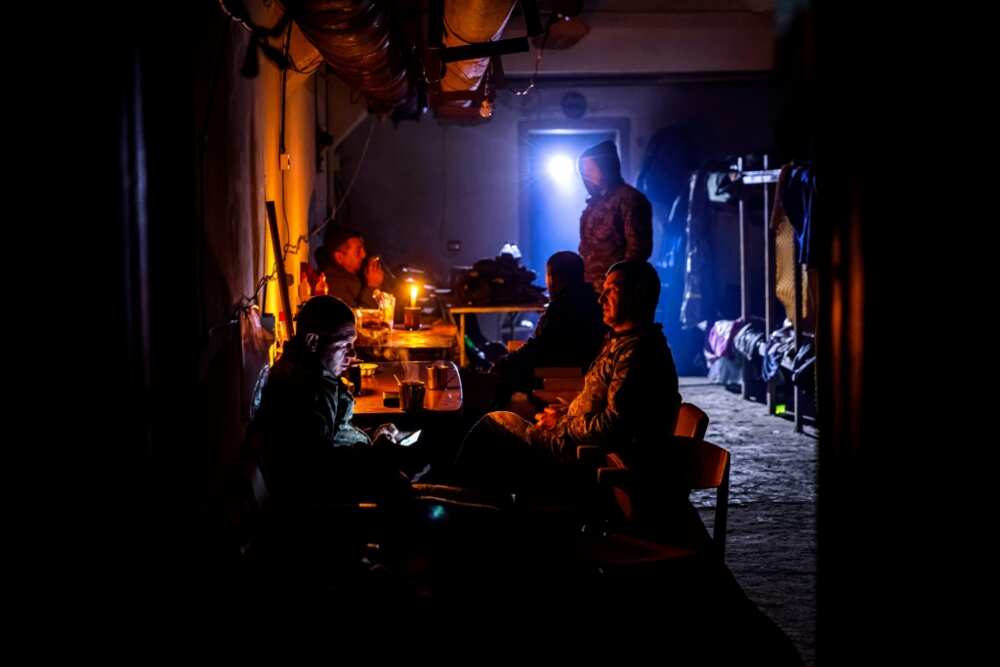 The basement of an anonymous building shelters the brigade's command post and garrison just five kms from Russian positions
