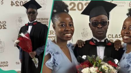 After 20 years in the UK, Nigerian man graduates with his twin daughters in attendance