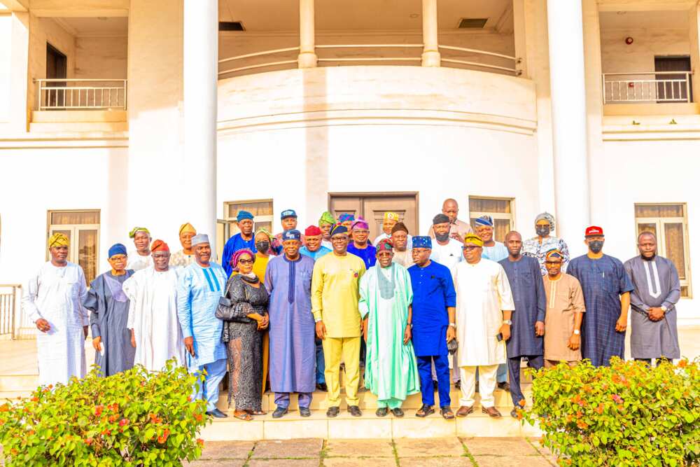 Bola Tinubu with members of APC and PDP