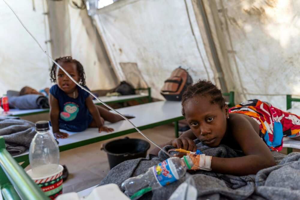 Children suffering from cholera symptoms receive care at a Doctors Without Borders center in the Port-au-Prince district of Cite Soleil on October 7, 2022
