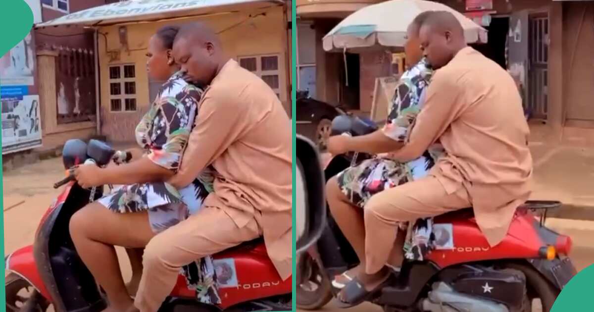 Video: See what this man was doing on the back of a woman carrying him on a bike
