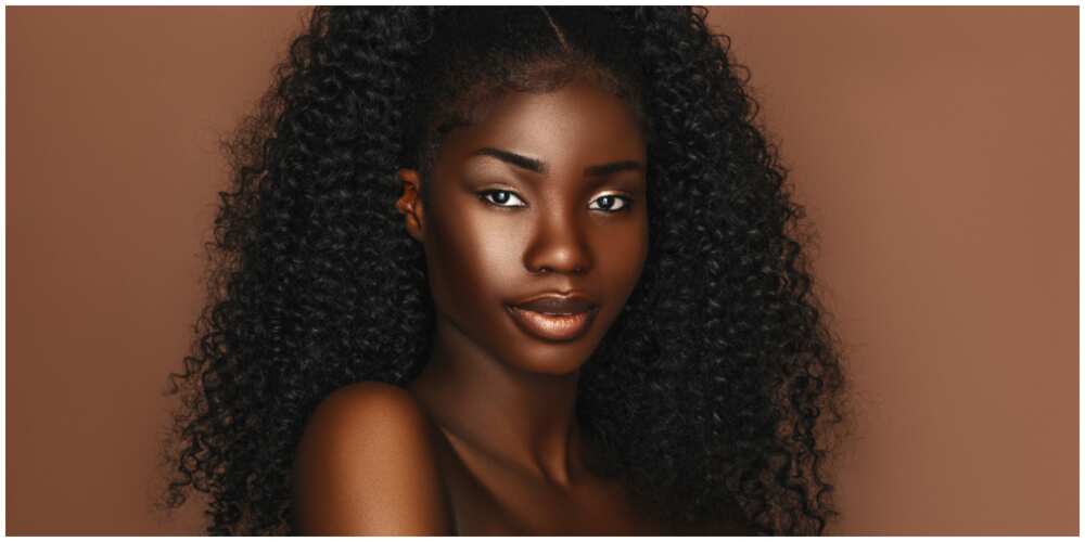 A photo of a dark-skinned model.