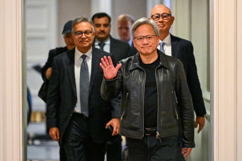 Jensen Huang, cofounder and CEO of Nvidia, waves as he arrives for a media roundtable in Kuala Lumpur on December 8, 2023