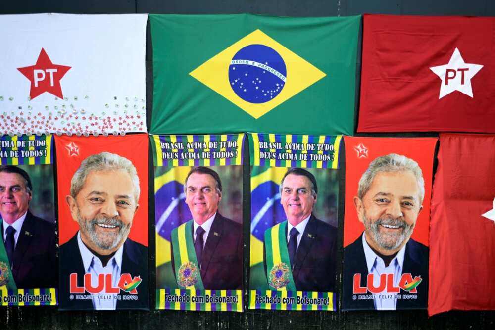 Towels bearing the images of Brazilian president and re-election candidate Jair Bolsonaro and his rival, former president Luiz Inacio Lula da Silva, on sale at a street stall in Belo Horizonte, Brazil, in October 2022