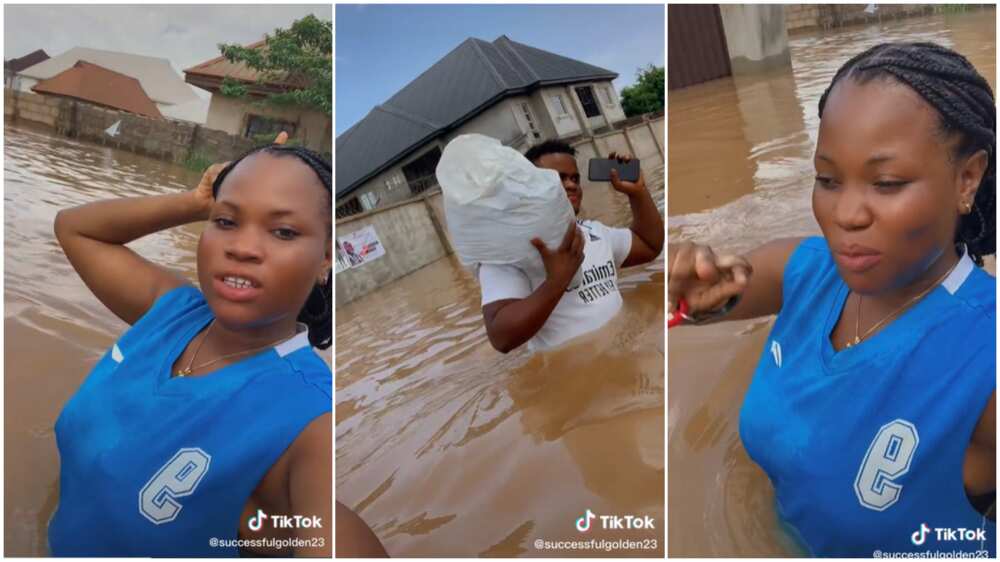 Flood crisis in Delta/lady swimming through flooded street.
