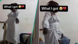"Straight to river with calabash": Lady orders white gown, gets low-quality design, amuses netizens