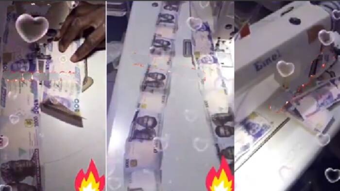 Too much money: Nigerian tailor seen making new year outfit with 500 and 1000 Naira notes, breaking CBN rules