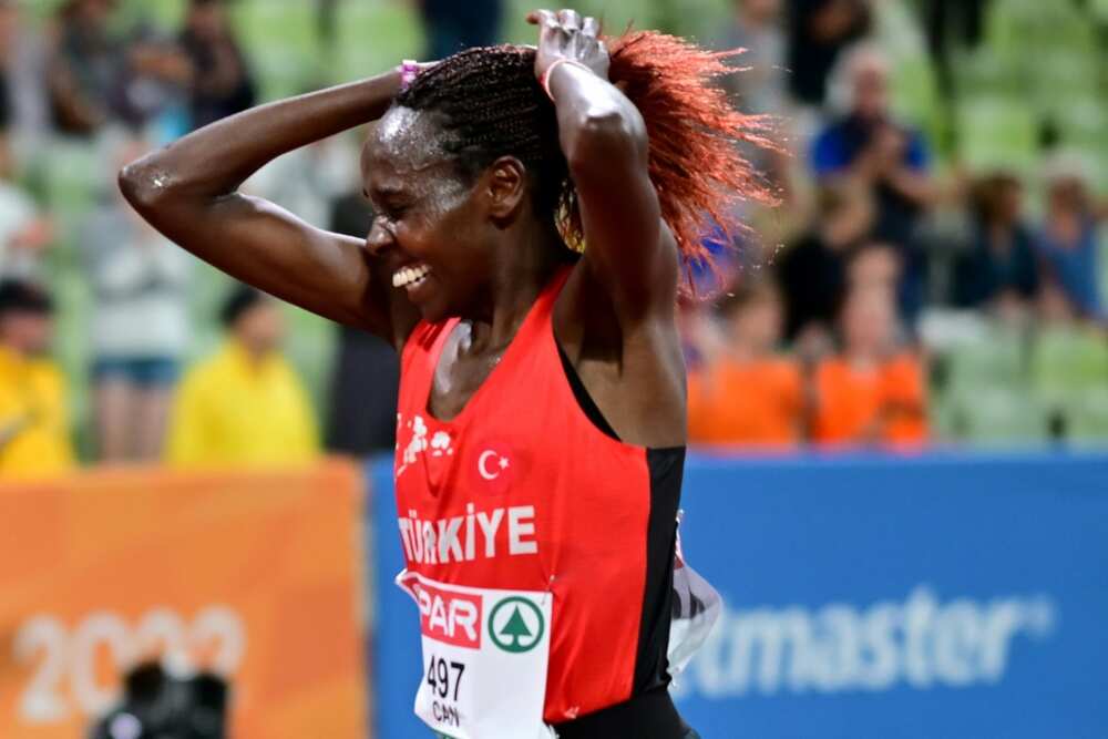 Turkey's Yasemin Can celebrates her victory in the women's 10,000m Turkey's Yasemin Can celebrates her victory in the women's 10,000m