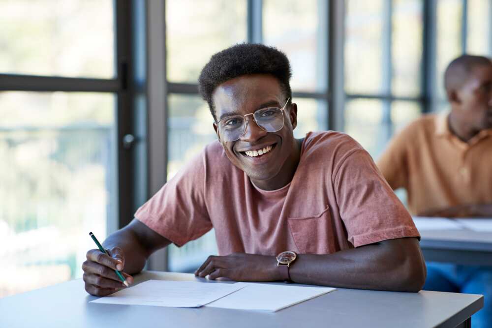 A male student in a classroom