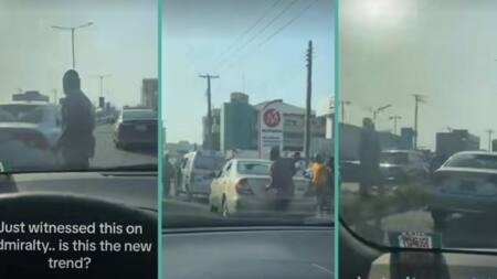 "People wey dey craze": 2 men stand in middle of road to destroy each other's cars, video trends