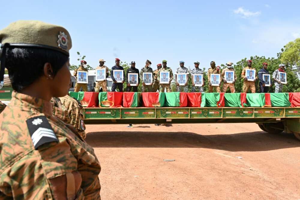 Toll: A funeral for 27 soldiers who were killed in an ambush in August as they escorted a large convoy of truck in the north of the country