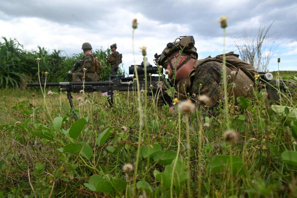 A US marine sniper takes aim during a joint amphibious landing exercise with Philippine counterparts in San Antonio