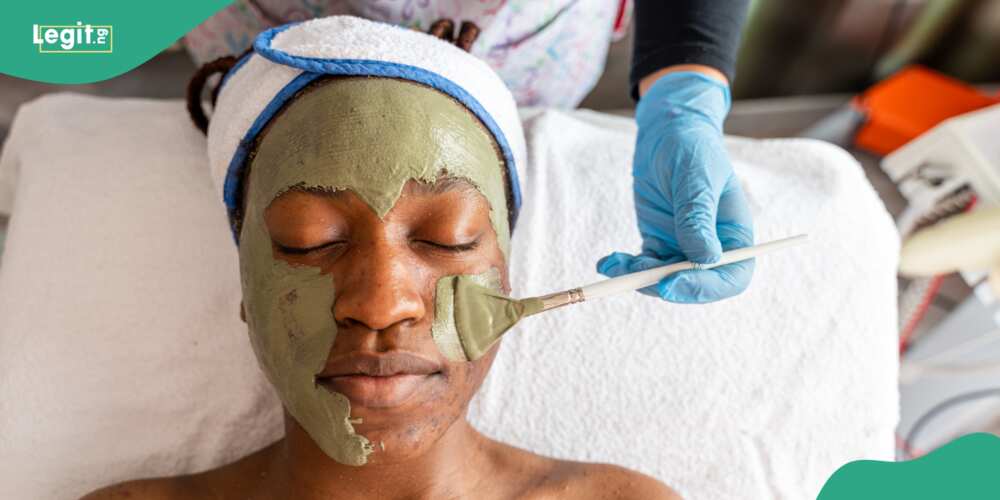 A lady wears a makeup mask