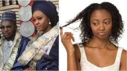 Photo of Nigerian couple wearing rolls of dollars and naira like chains on their necks on wedding day